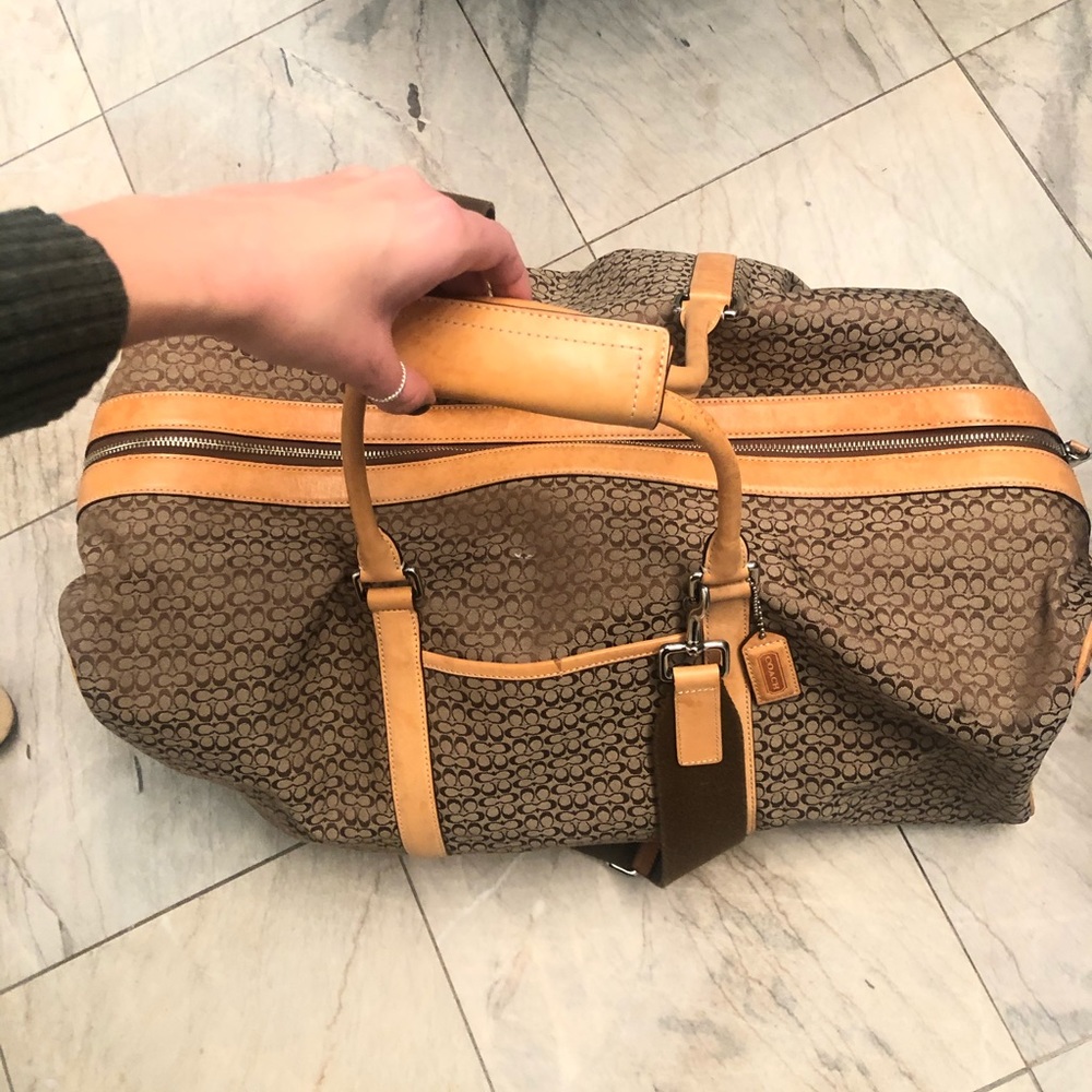 Authentic Coach weekender bag. Tan leather trim.